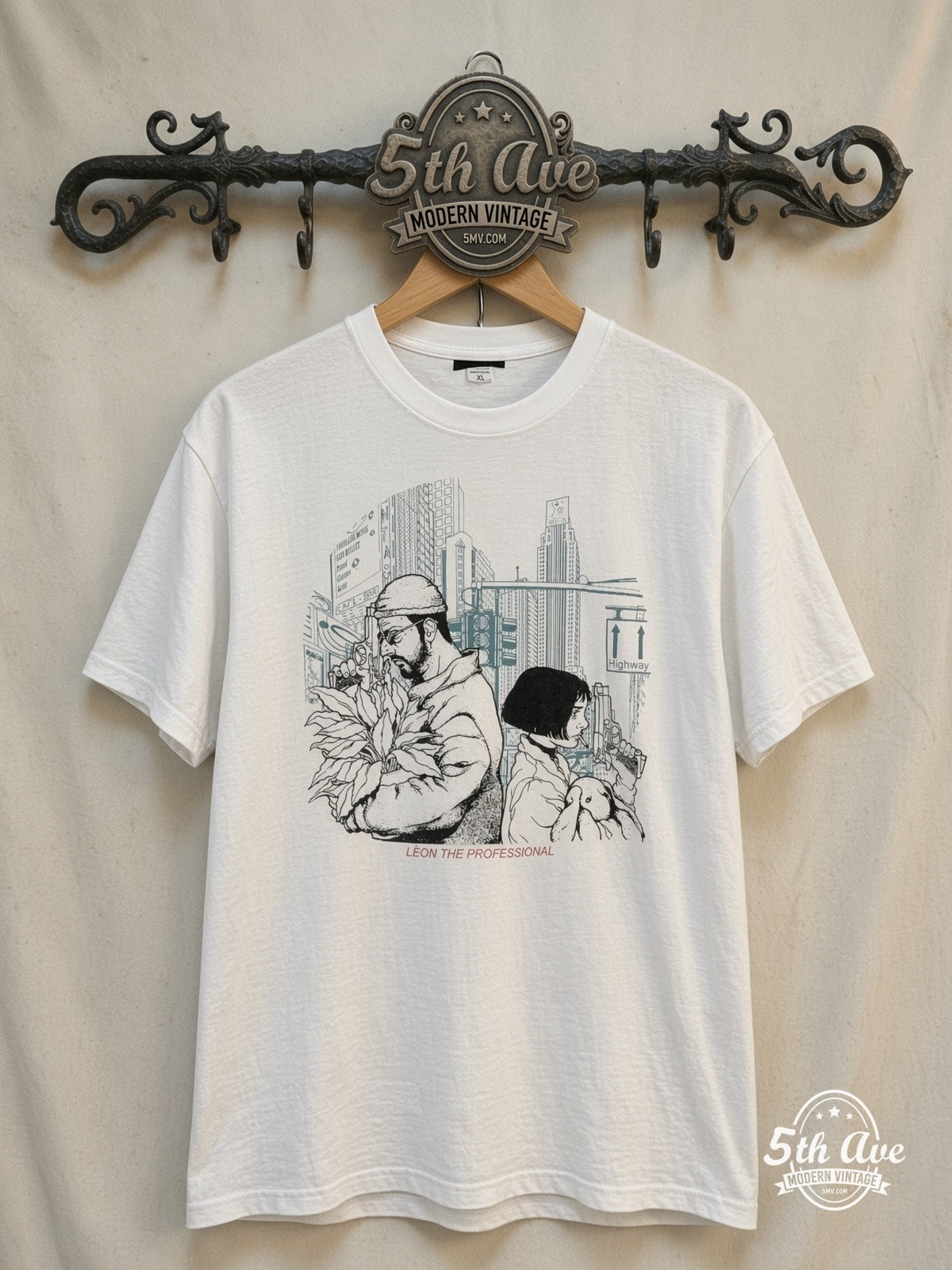 Léon The Professional – Vintage Movie Tee — front on locked cream ornate 5th Ave rack