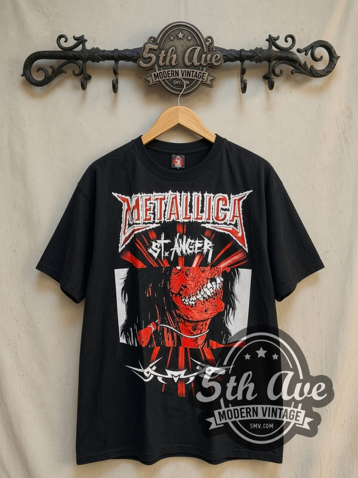 Metallica St. Anger vintage band t-shirt, front view on a display rack