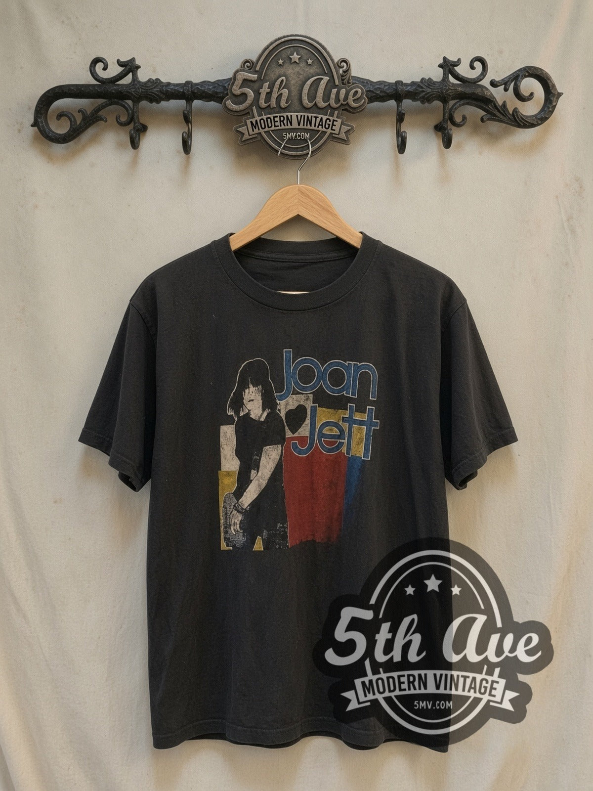 Joan Jett Bad Reputation vintage band t-shirt, front view on a display rack