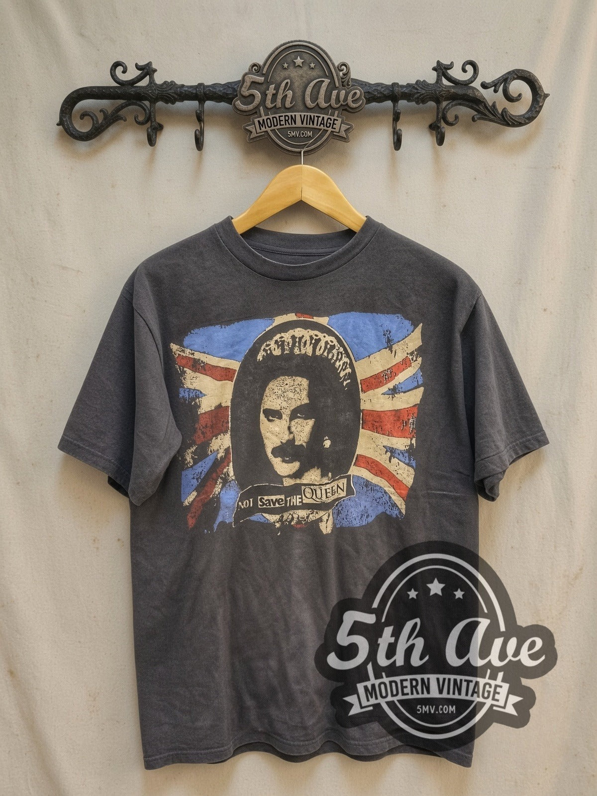 Queen Not Save The Queen Punk Parody vintage band t-shirt, front view on a display rack