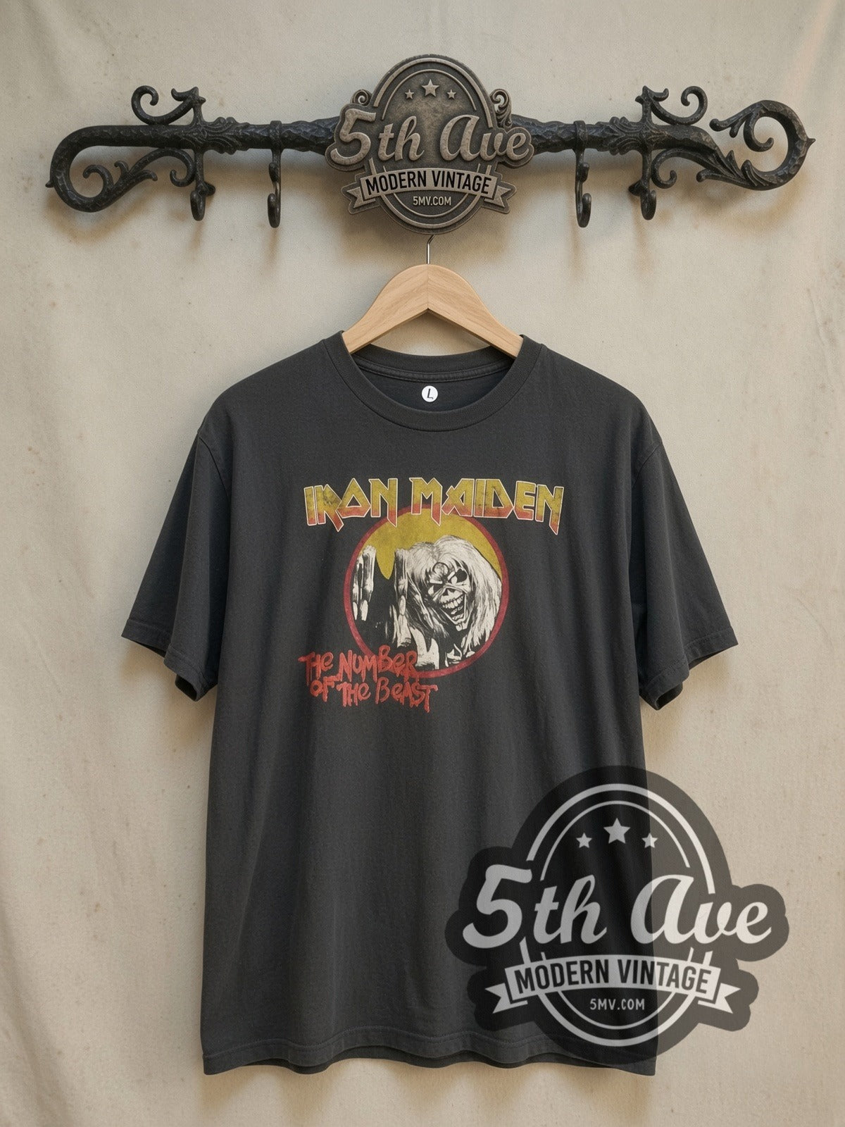 Iron Maiden The Number of the Beast Circle Logo vintage band t-shirt, front view on a display rack