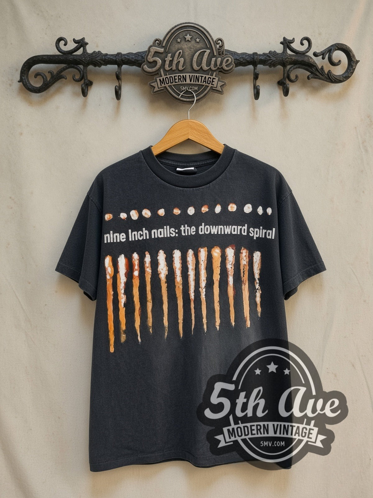 Nine Inch Nails NIИ 'The Downward Spiral' 1994 vintage band t-shirt in black, front view on a display rack