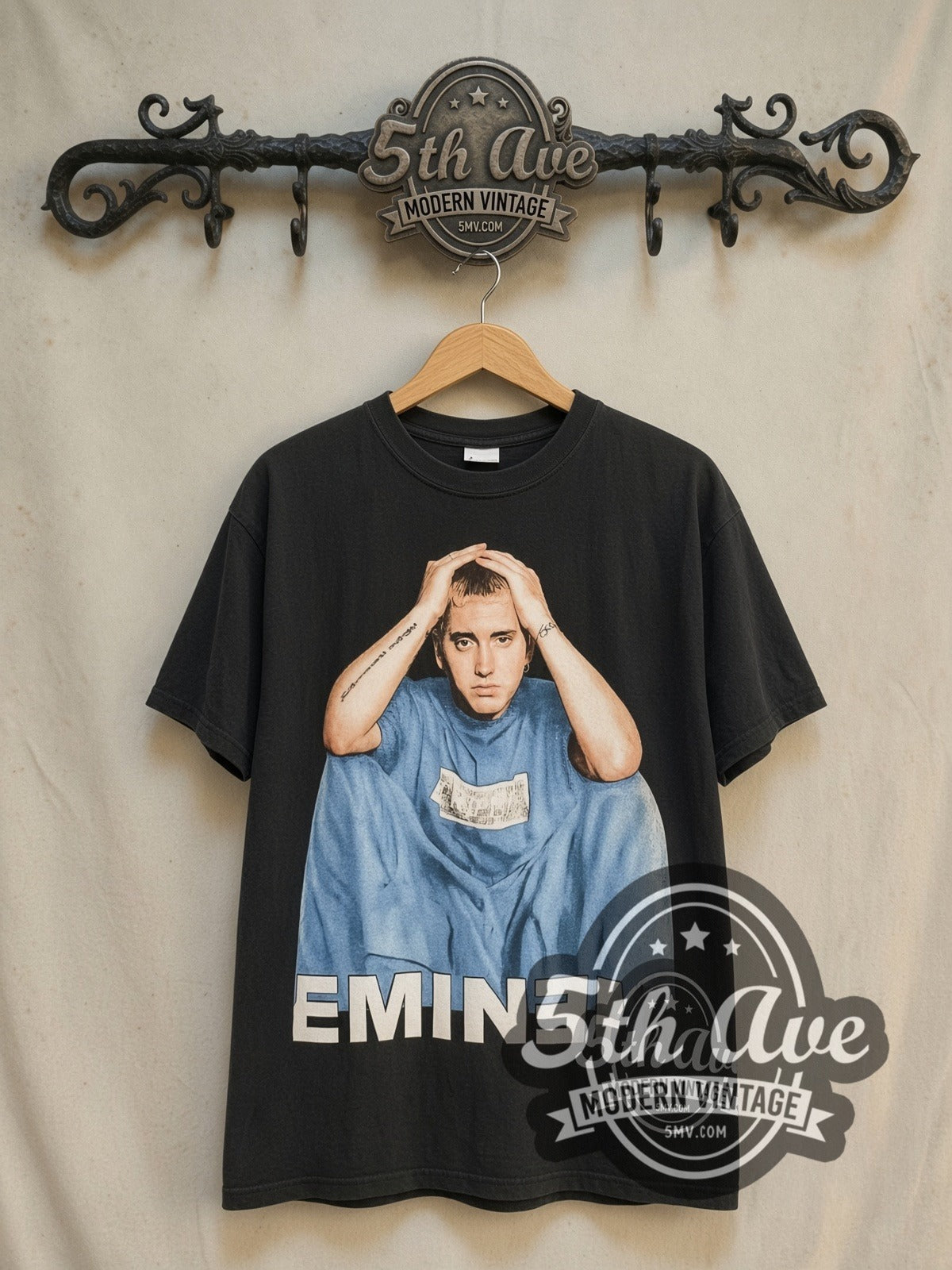 Eminem The Marshall Mathers LP "EMINƎM" vintage band t-shirt in black, front view on a display rack