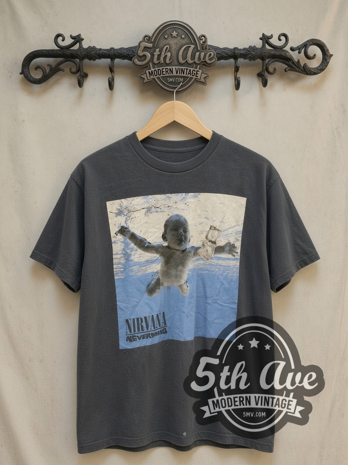 Nirvana Nevermind Baby Cover vintage band t-shirt, front view on a display rack
