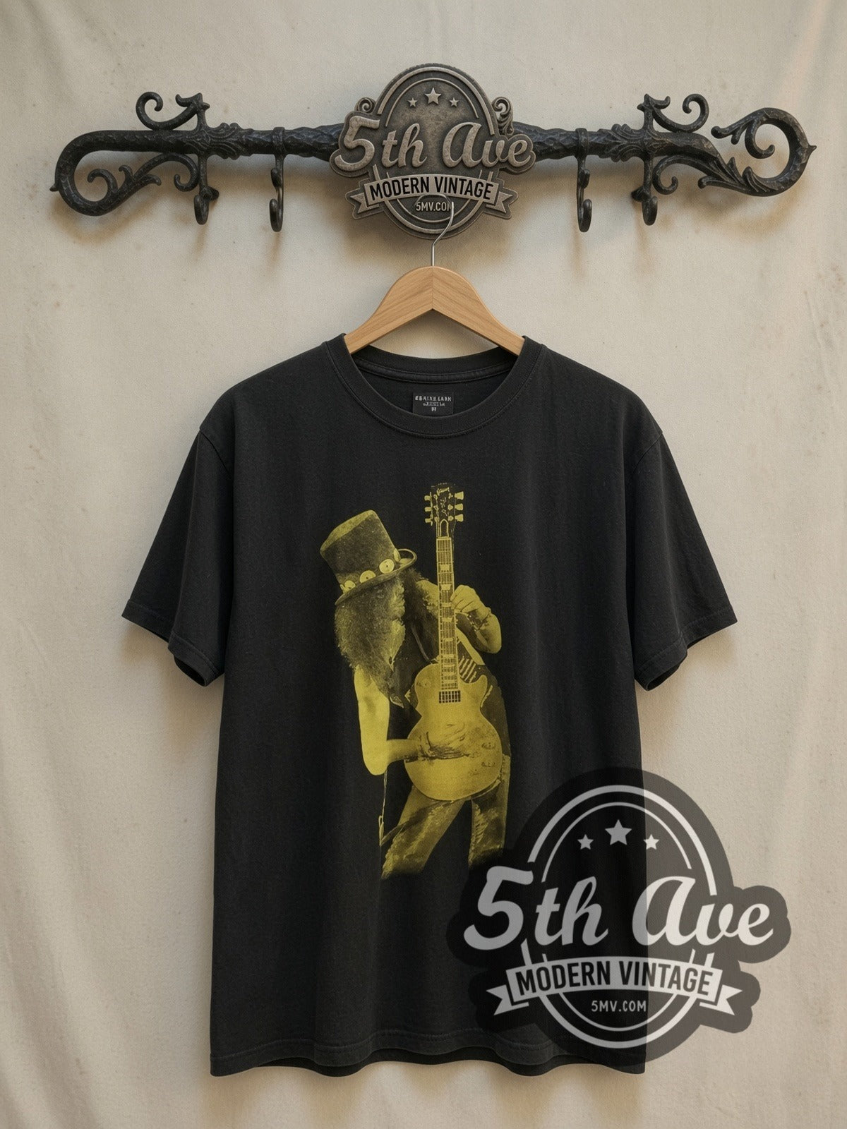 Guns N' Roses Slash vintage band t-shirt, front view on a display rack