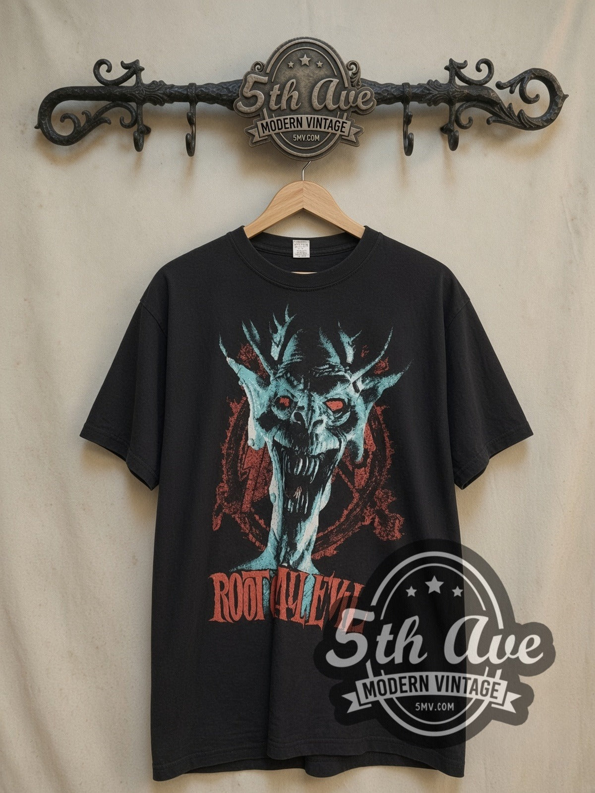 Slayer Root of All Evil vintage band t-shirt, front view on a display rack