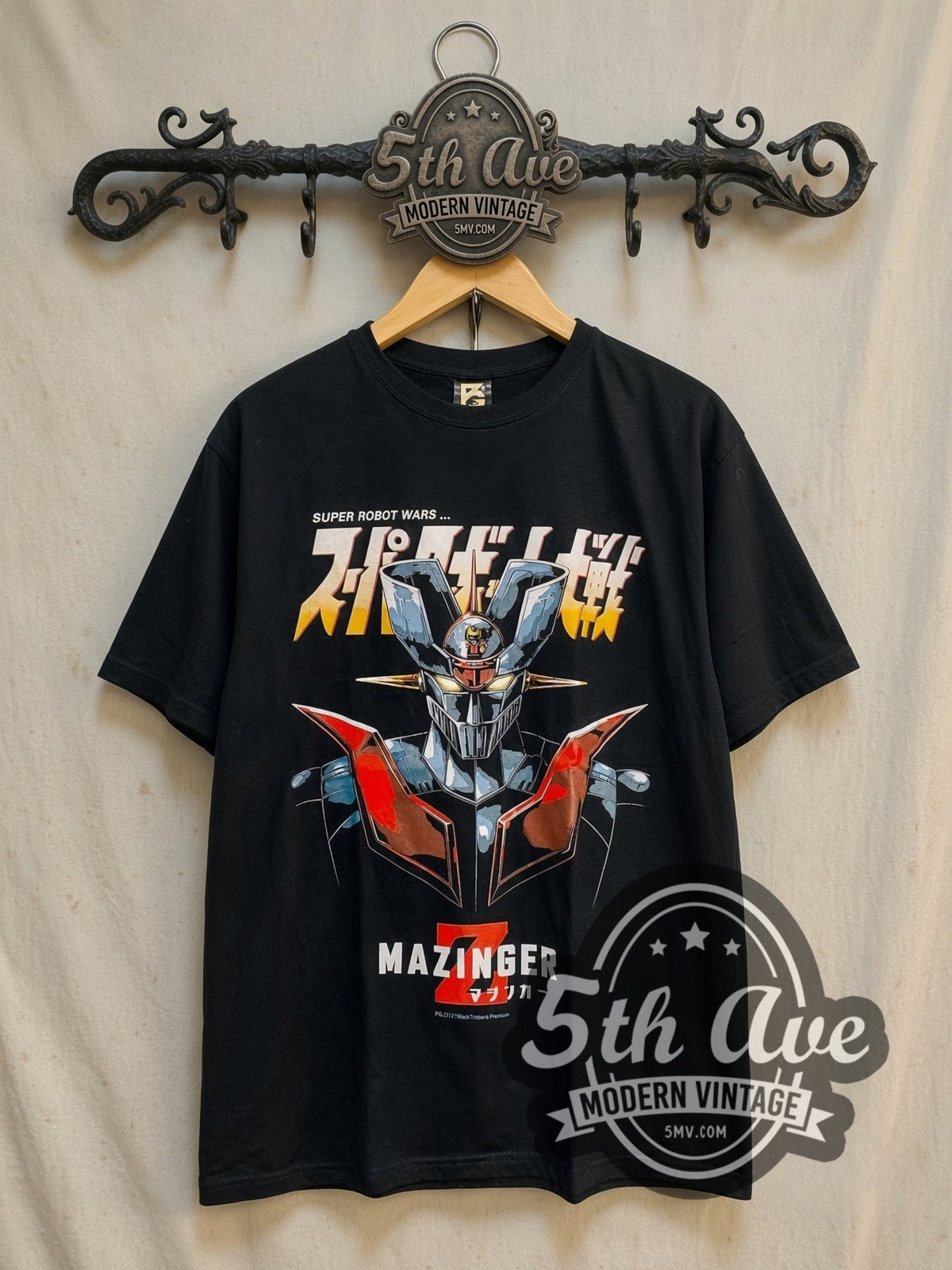 Mazinger Z vintage graphic t-shirt, front view on a display rack