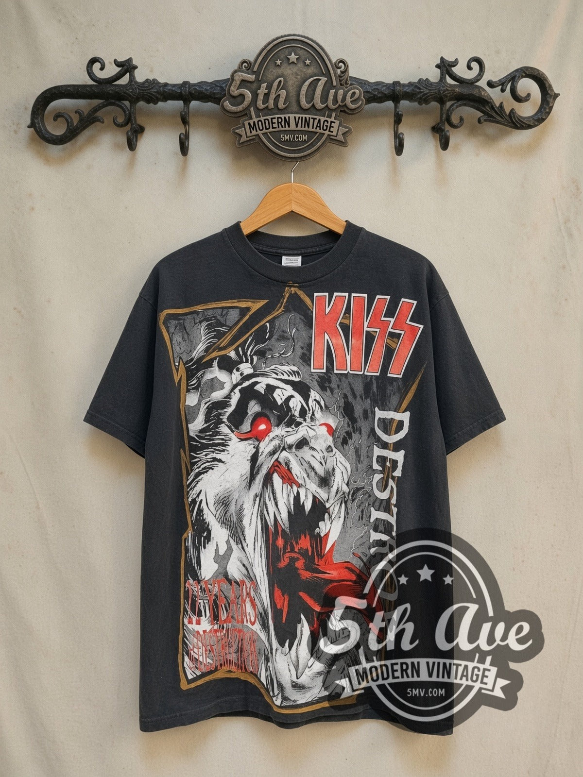 KISS Destroyer 22 Years of Destruction all-over-print vintage band t-shirt in black, front view on a display rack