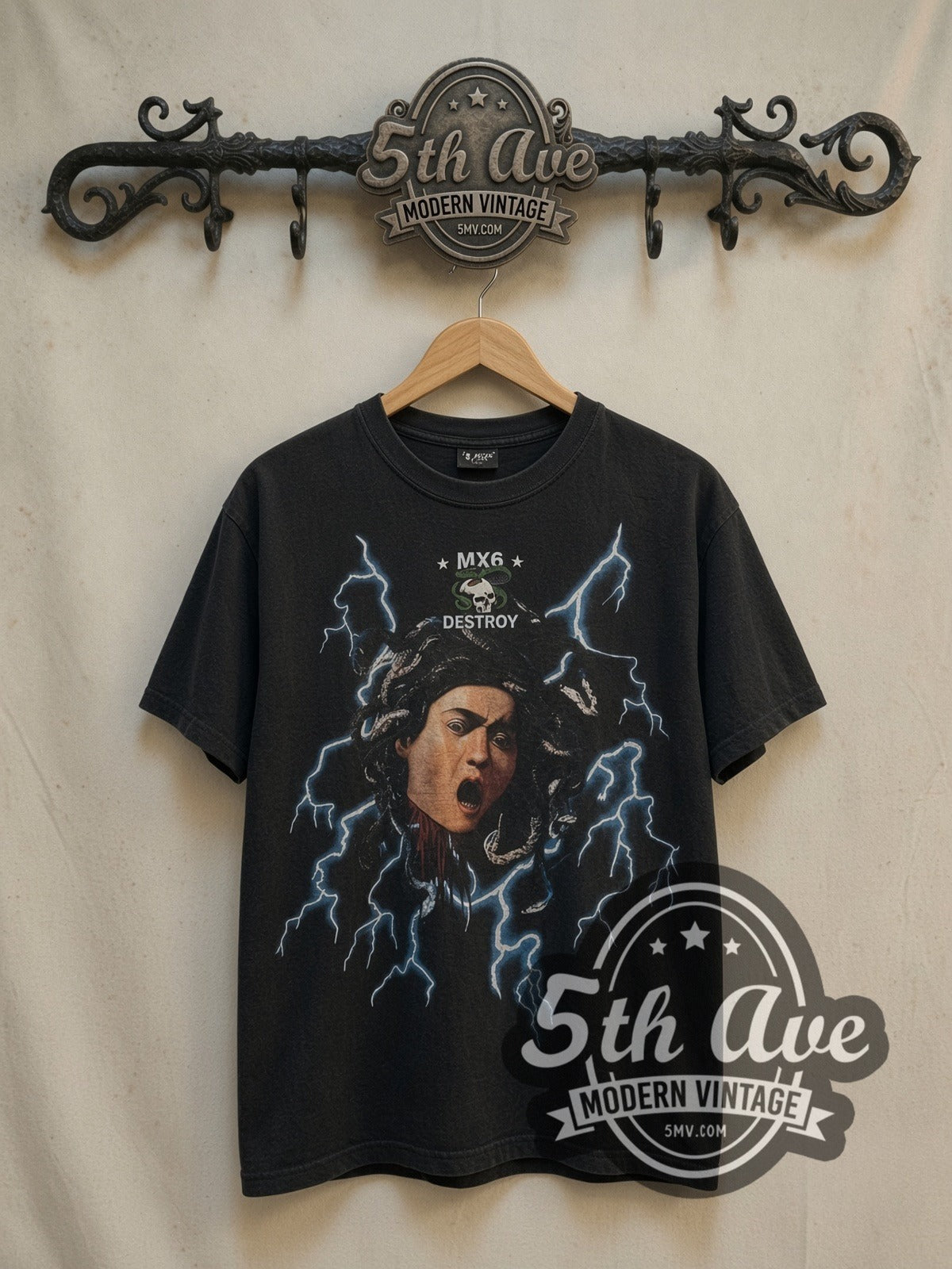 Saint Medusa MX6 Destroy vintage graphic tee, front view on a display rack