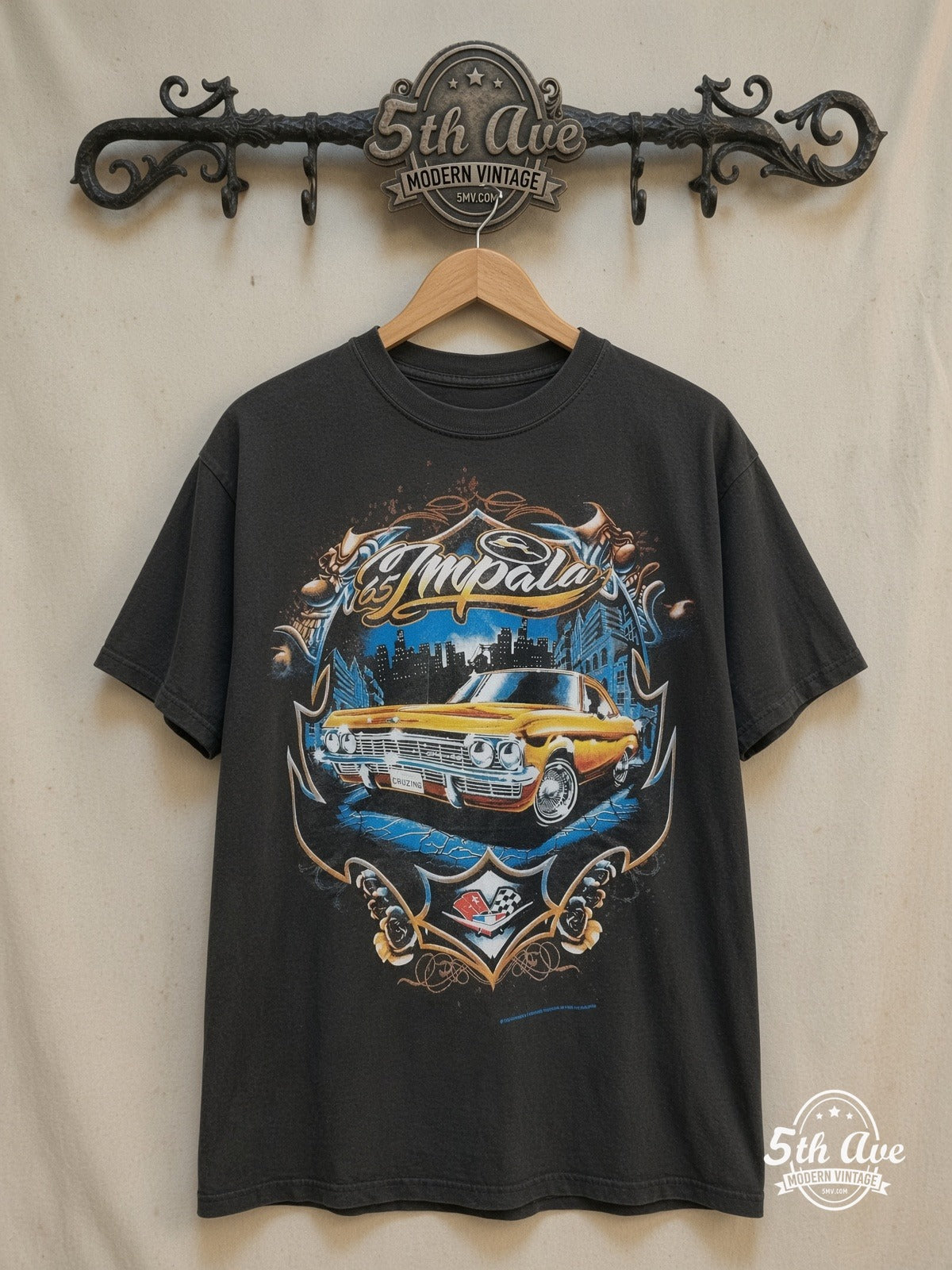 Rollin Hard – '65 Chevy Impala Lowrider – Vintage Graphic Tee — front on locked cream ornate 5th Ave rack