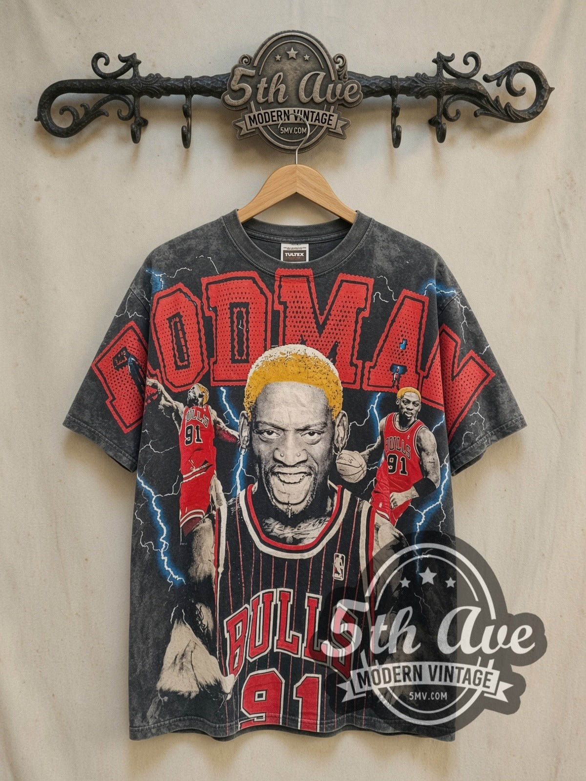 Dennis Rodman Chicago Bulls all-over-print graphic tee in black, front view on a display rack