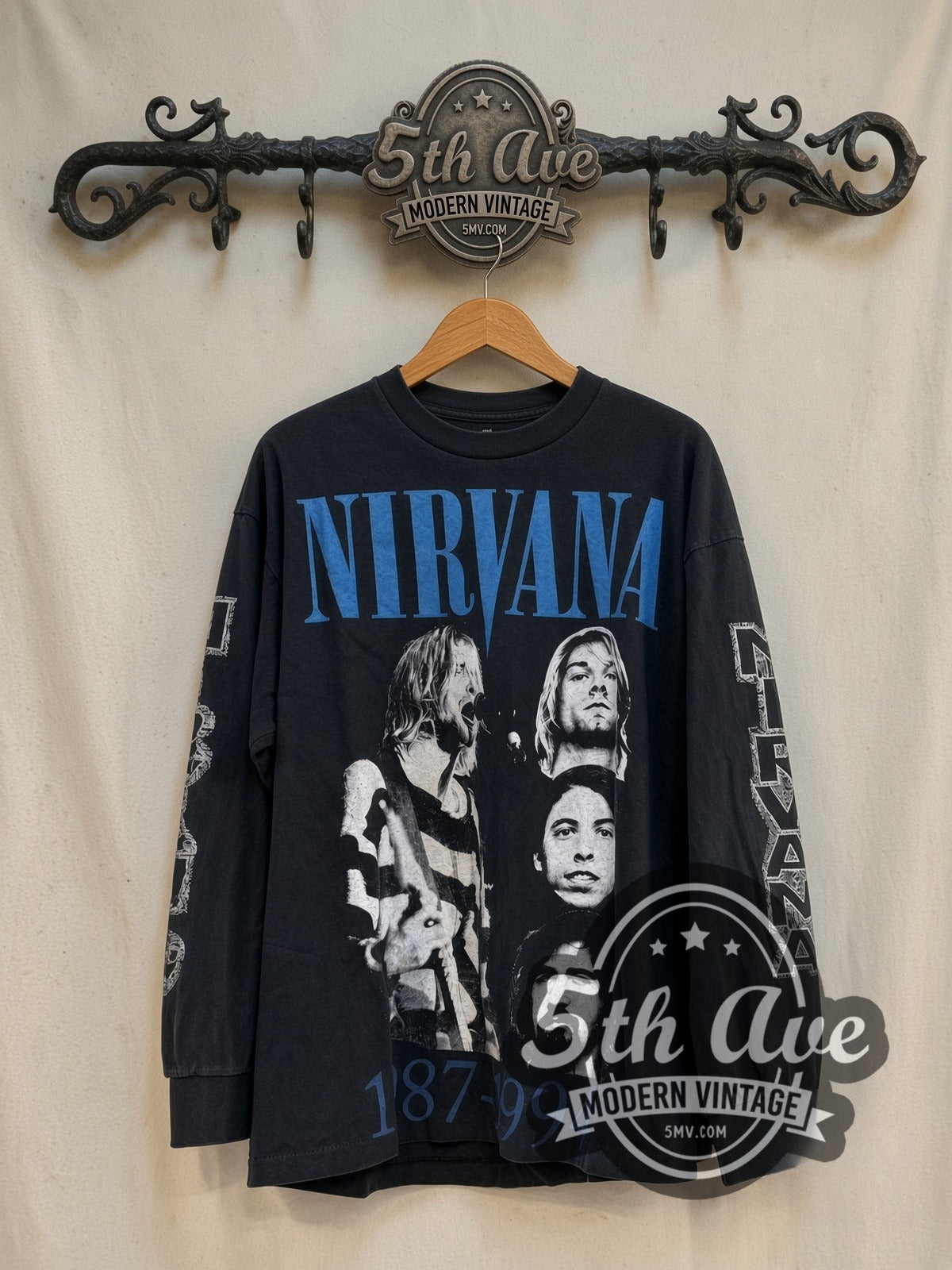 Nirvana 1987-1994 Band Portraits Long Sleeve vintage band t-shirt in black, front view on a display rack