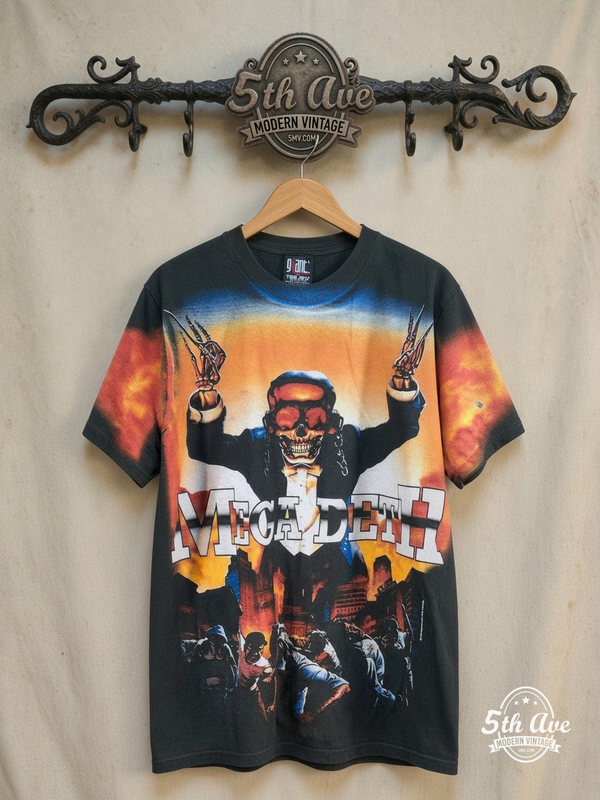 Megadeth – Peace Sells Vic Rattlehead Tuxedo All Over Print – Vintage Band T-Shirt — front on locked cream ornate 5th Ave rack