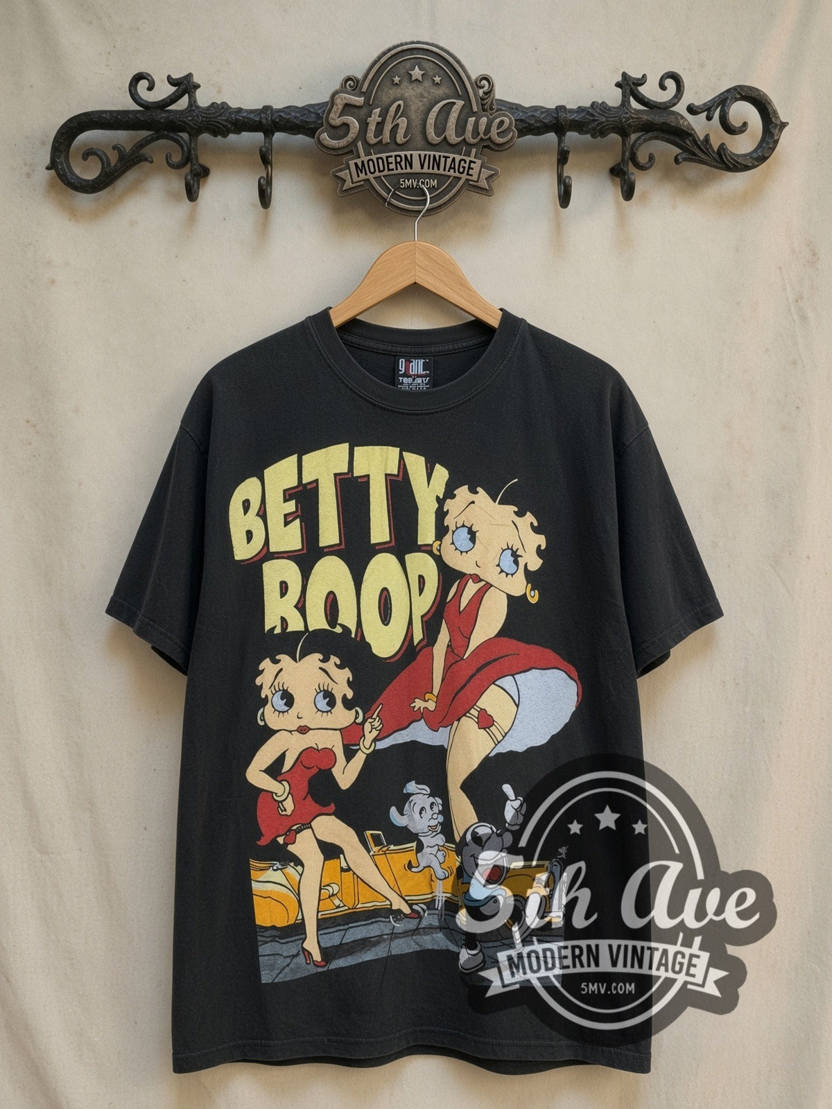 Betty Boop What Would You Like to Order all-over-print vintage cartoon tee, front view on a display rack