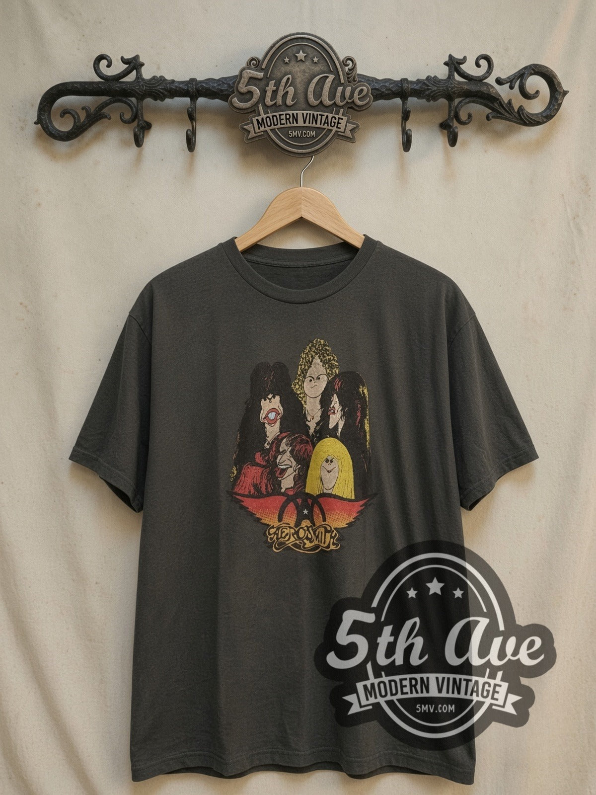Aerosmith Cartoon Caricatures vintage band t-shirt, front view on a display rack