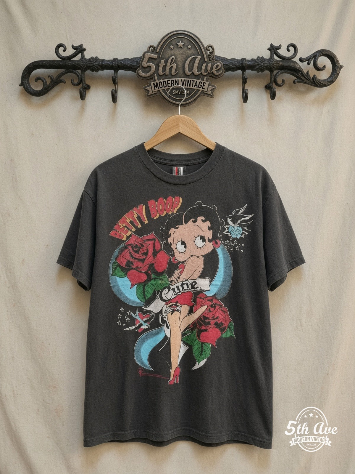 Betty Boop – Cutie Tattoo Roses Black Tee – New Vintage Graphic Tee — front on locked cream ornate 5th Ave rack