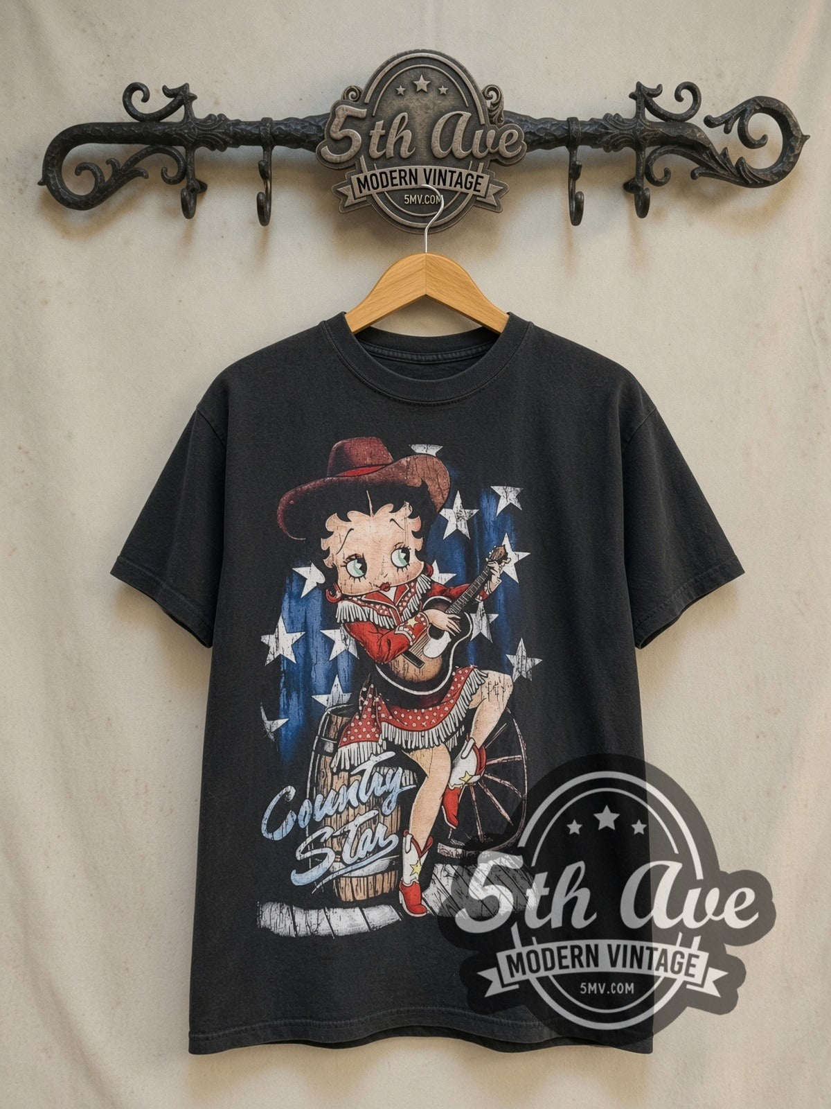 Betty Boop Country Star Country Girl vintage cartoon tee in black, front view on a display rack