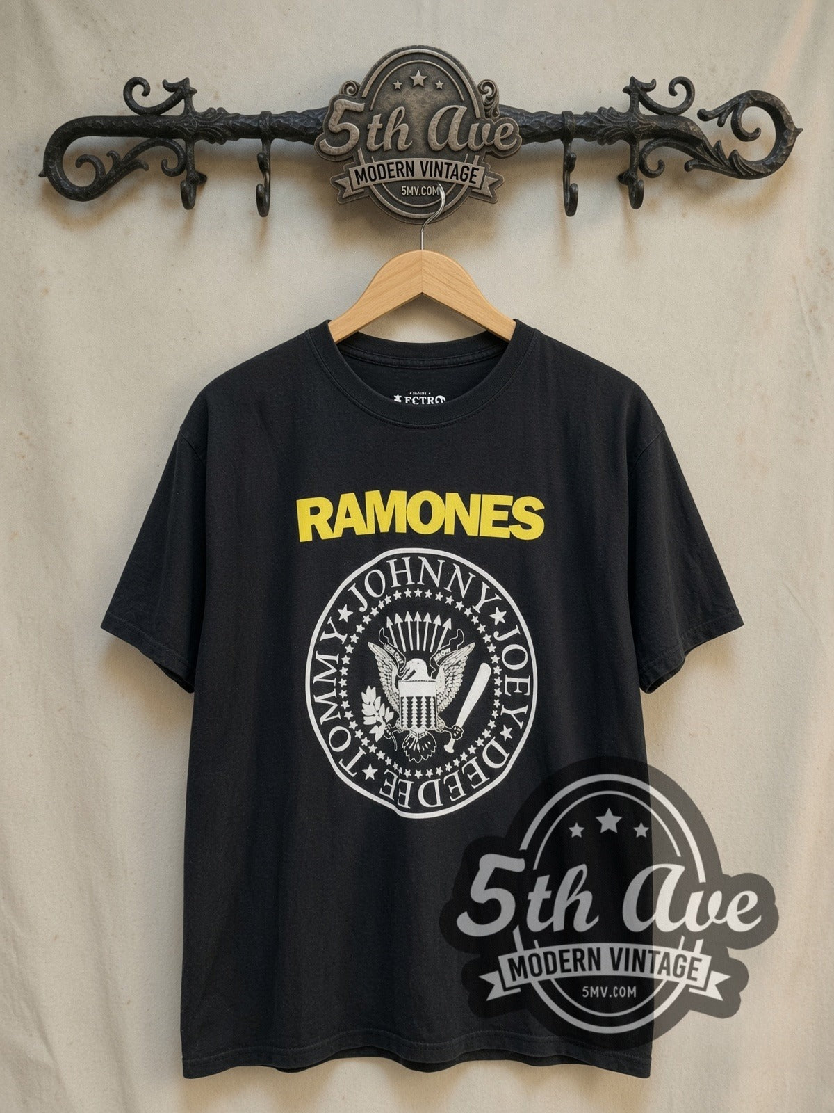 The Ramones vintage band t-shirt, front view on a display rack