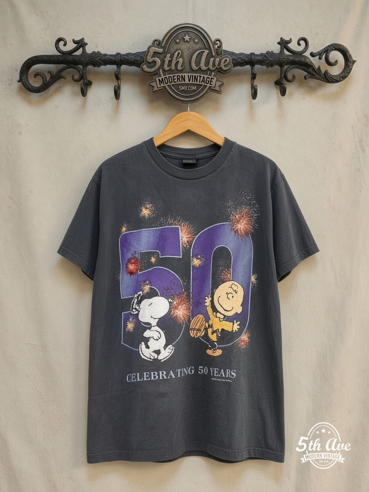 Peanuts – Celebrating 50 years – New Vintage Graphic Tee — front on locked cream ornate 5th Ave rack
