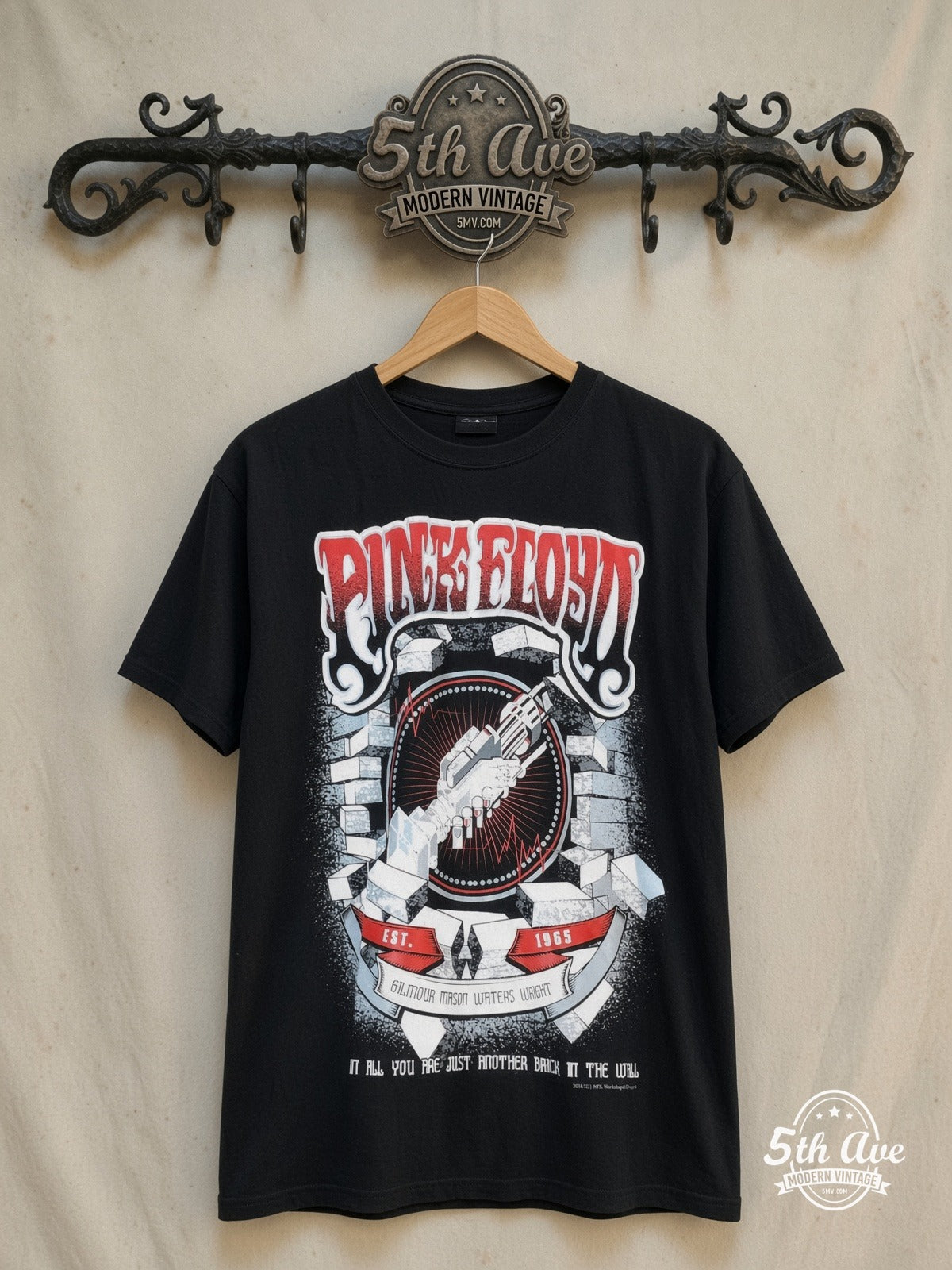 Pink Floyd – Another Brick In the Wall – Vintage Band T-Shirt — front on locked cream ornate 5th Ave rack