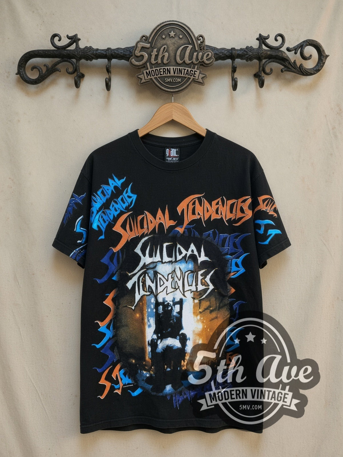 Suicidal Tendencies Electric Chair all-over-print vintage band t-shirt in black, front view on a display rack