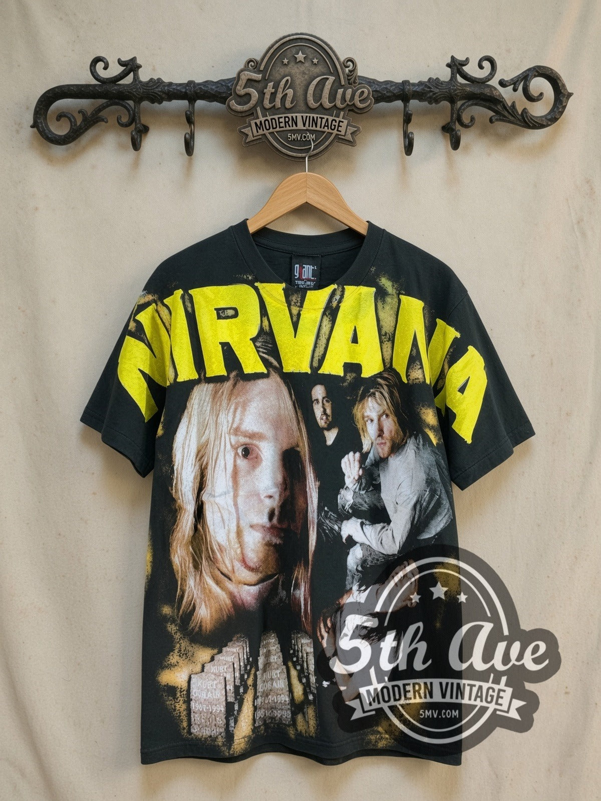 Nirvana Kurt Cobain Photo Collage all-over-print vintage band t-shirt, front view on a display rack
