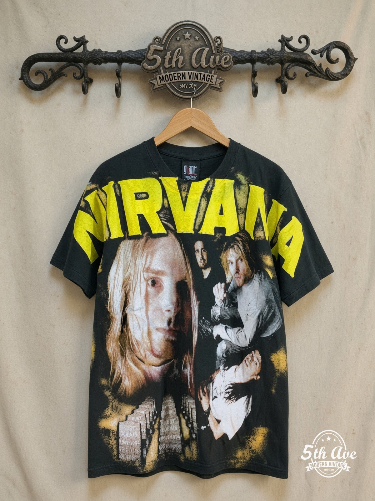 Nirvana – Nirvana – All Over Print – Vintage Band T-Shirt — front on locked cream ornate 5th Ave rack