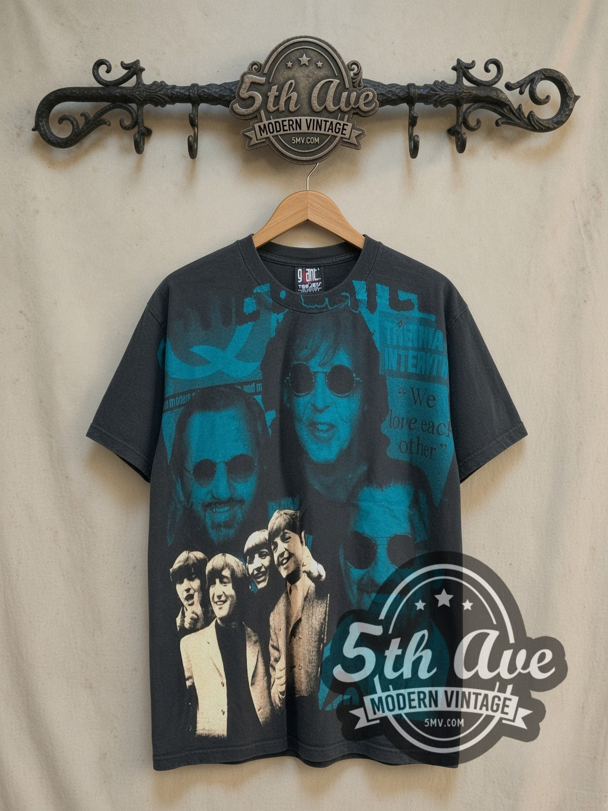 The Beatles Oh They Are Back! all-over-print vintage band t-shirt, front view on a display rack