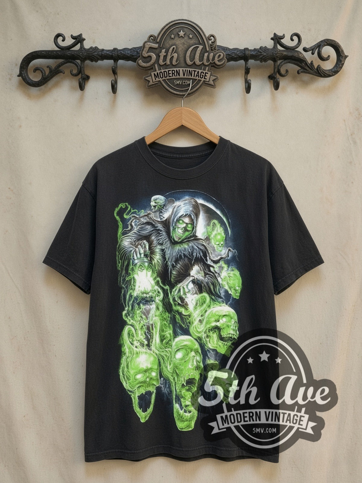 Reaper and Skulls Glow in the dark vintage graphic t-shirt, front view on a display rack