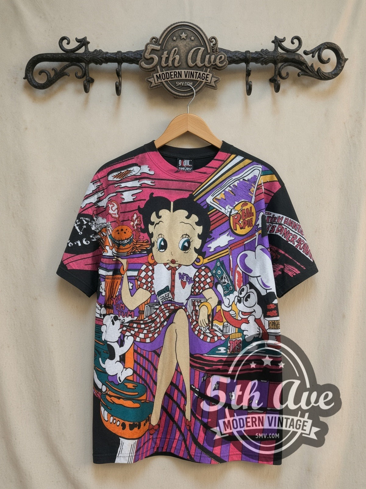Betty Boop's Diner Served Hot and Fresh all-over-print vintage cartoon tee, front view on a display rack