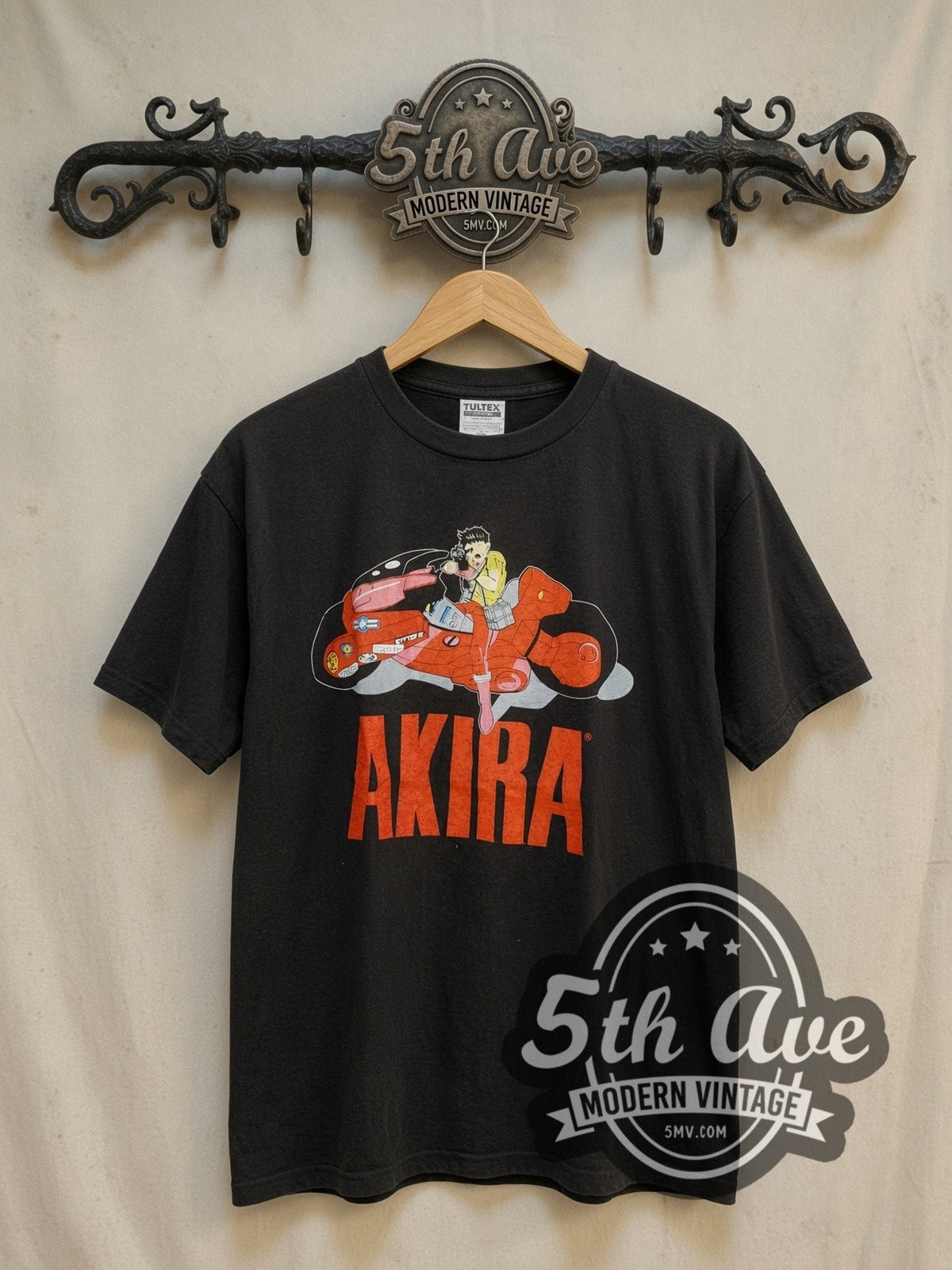 Akira Kaneda Motorcycle Logo vintage graphic t-shirt, front view on a display rack