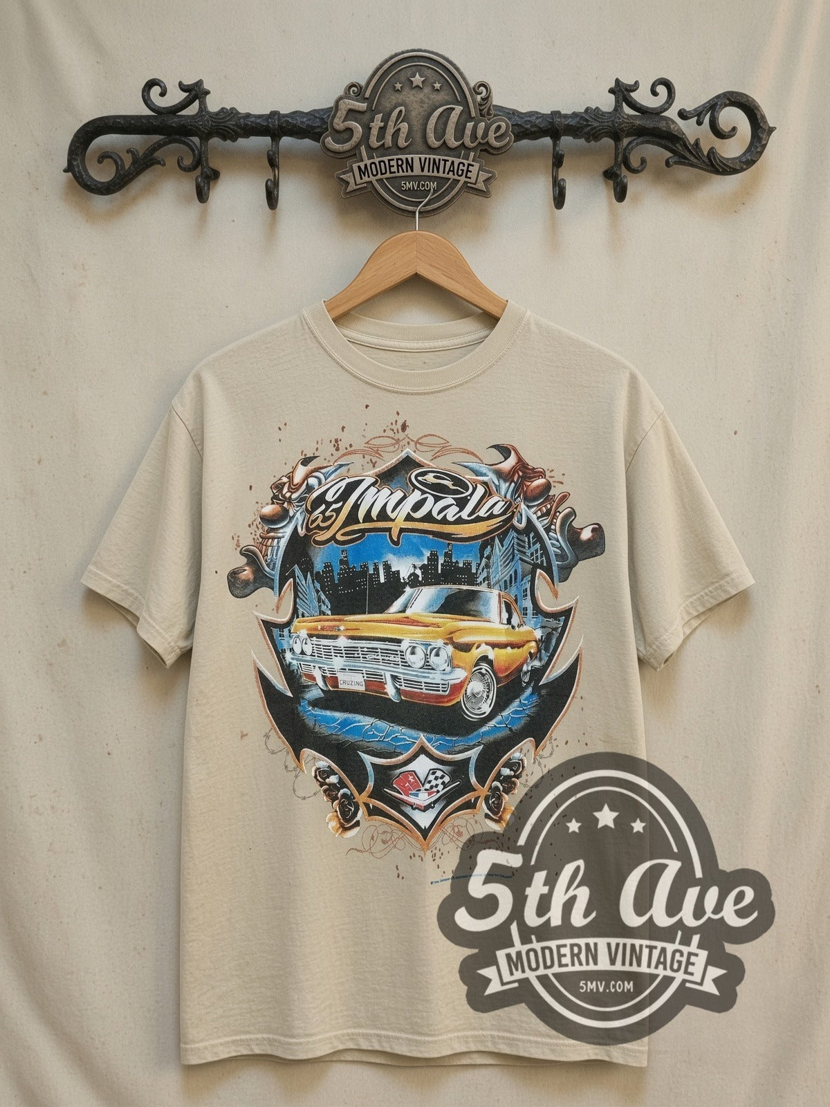 Rollin Hard Golden Impala Lowrider vintage graphic tee, front view on a display rack