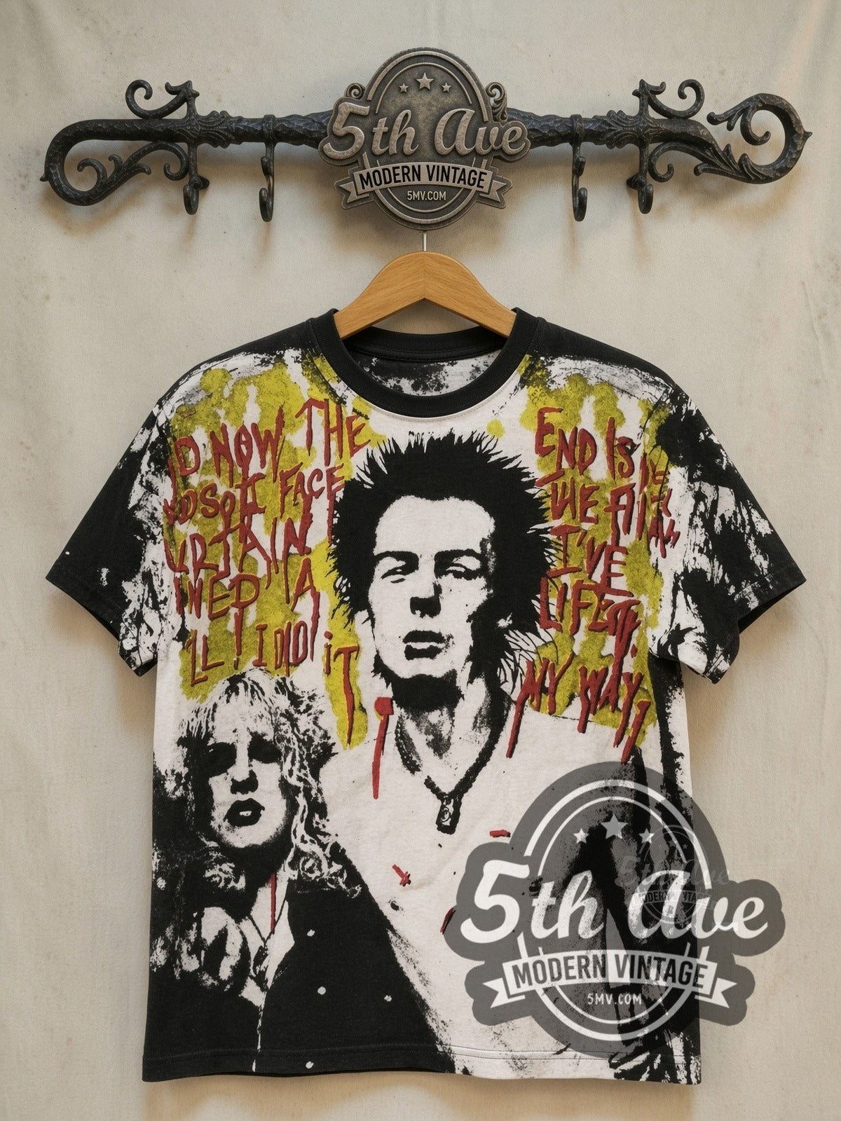 Sex Pistols Sid Vicious Sid and Nancy all-over-print vintage band t-shirt, front view on a display rack