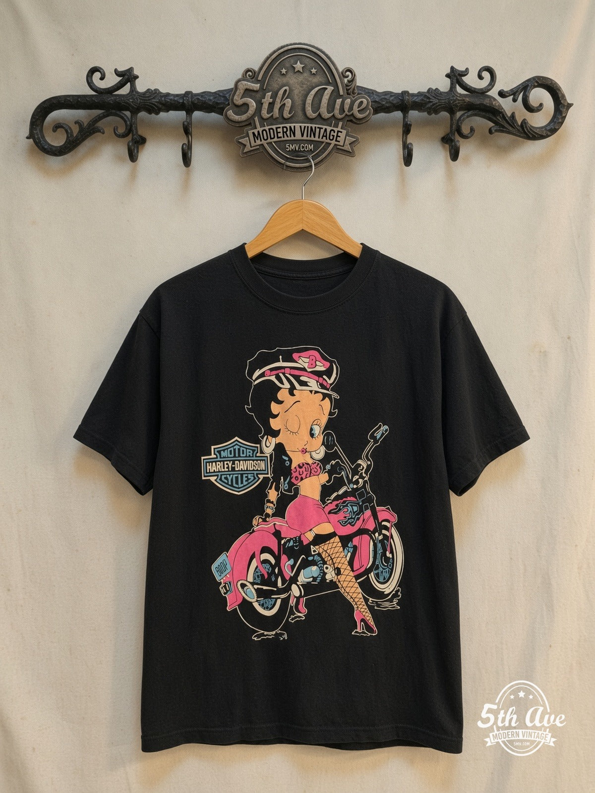 Betty Boop Harley Davidson graphic tee, front view on a display rack