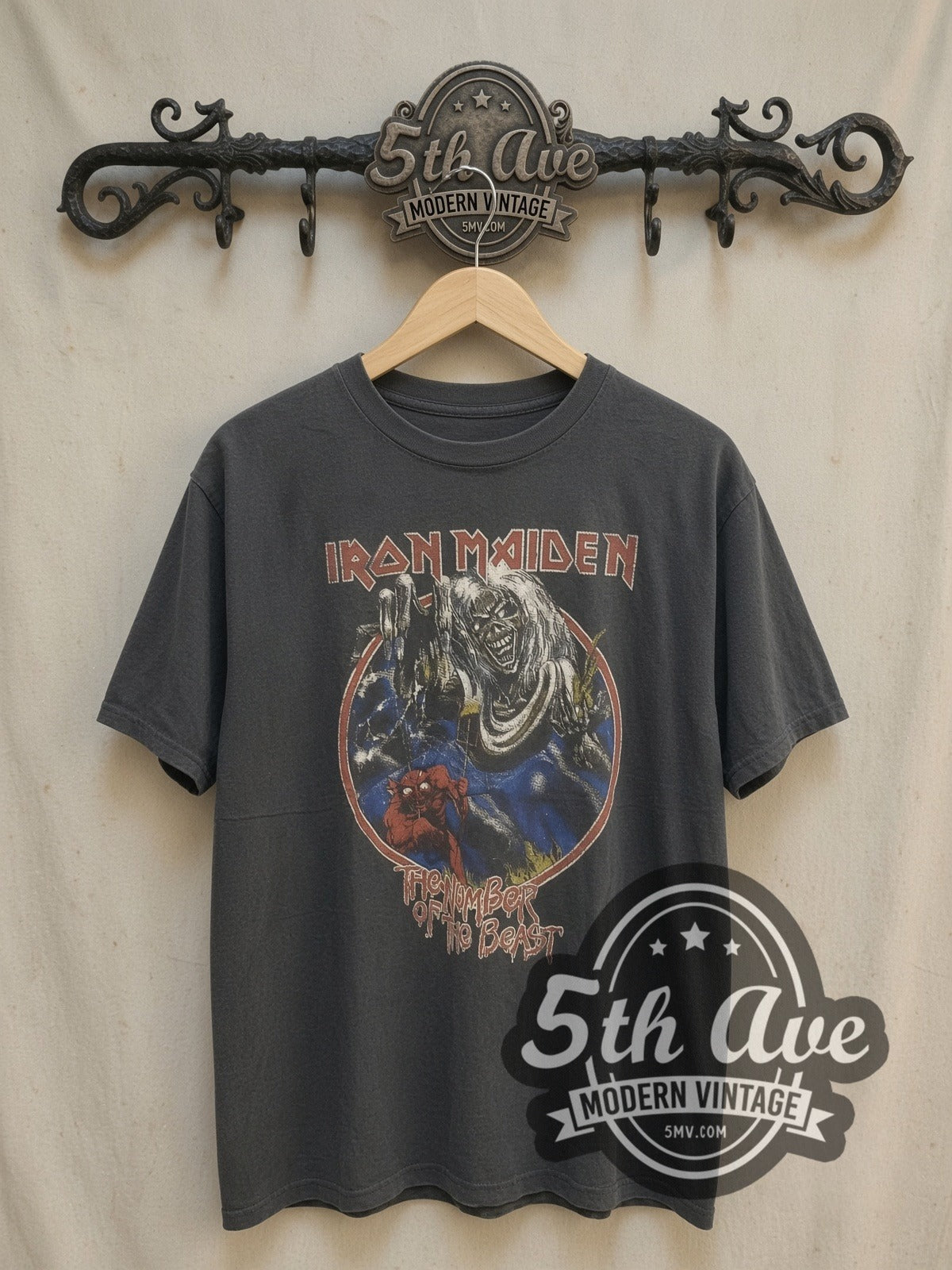 Iron Maiden The Number of the Beast vintage band t-shirt, front view on a display rack