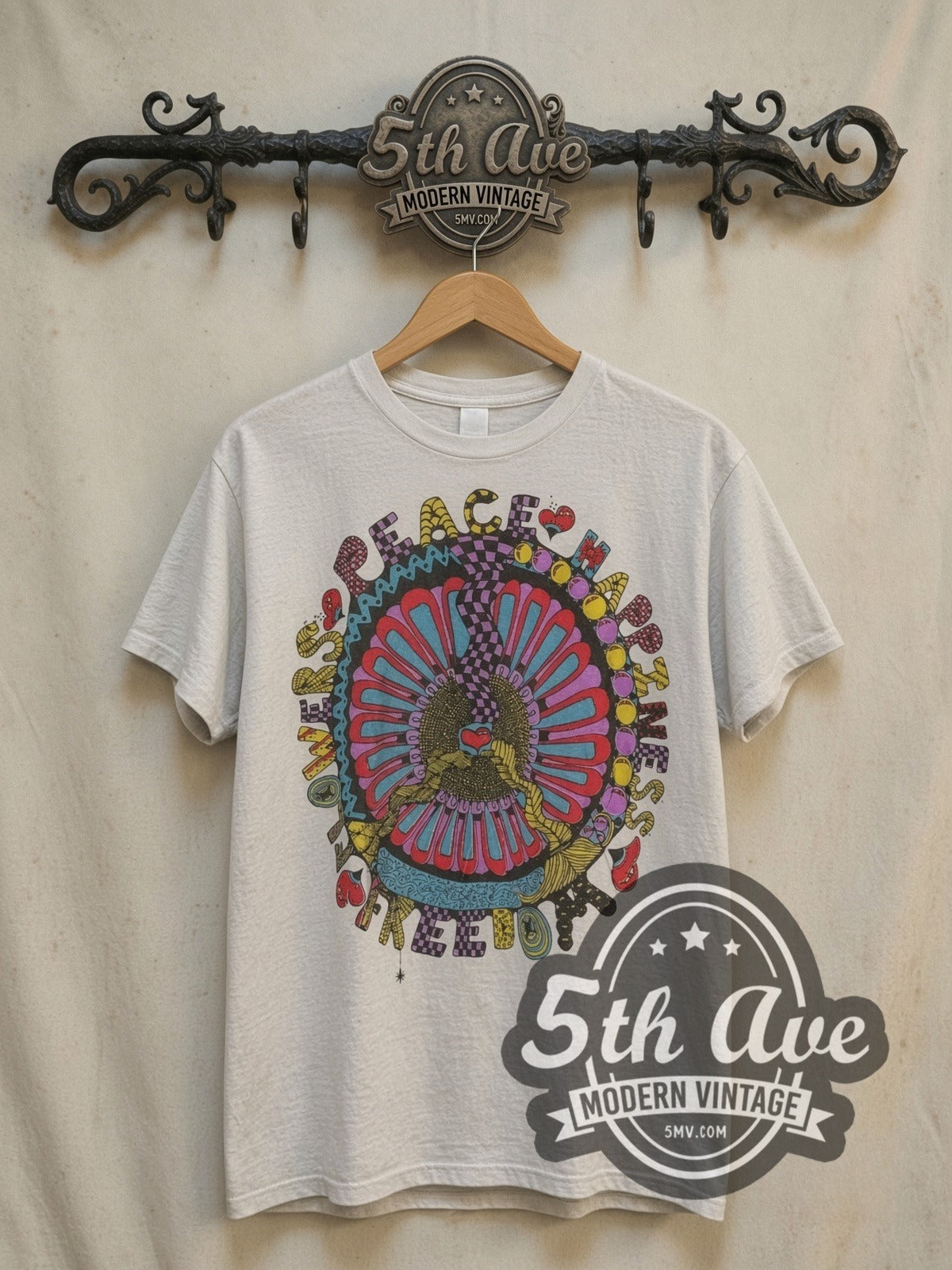 Bloom in Peace Celebration of Happiness and Freedom vintage graphic tee, front view on a display rack