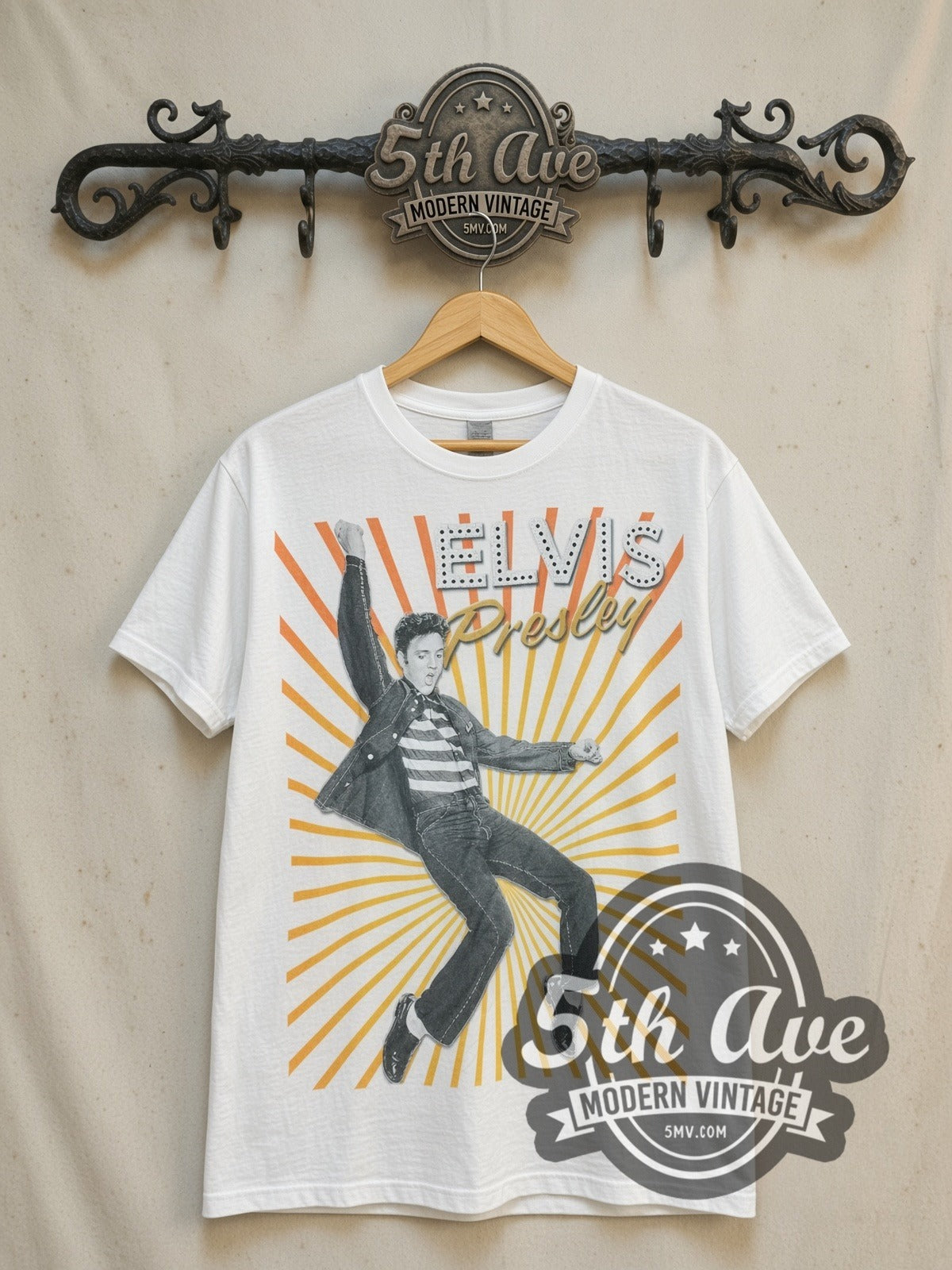Elvis Presley King of Rock and Roll vintage band t-shirt, front view on a display rack