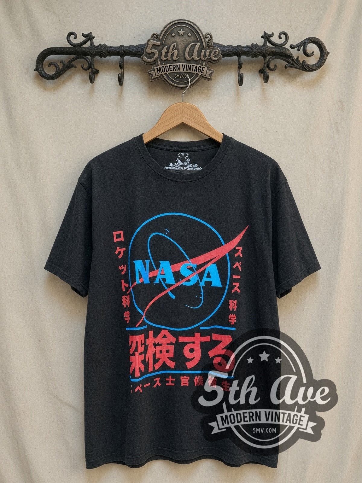 NASA vintage graphic tee, front view on a display rack