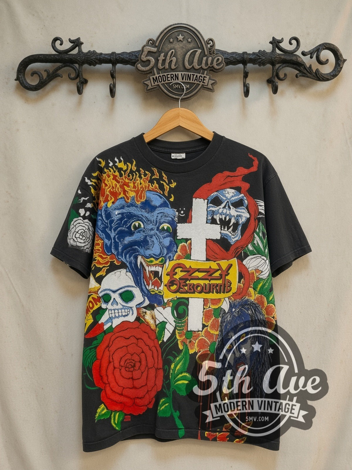 Ozzy Osbourne Tattoo all-over-print vintage band t-shirt in black, front view on a display rack
