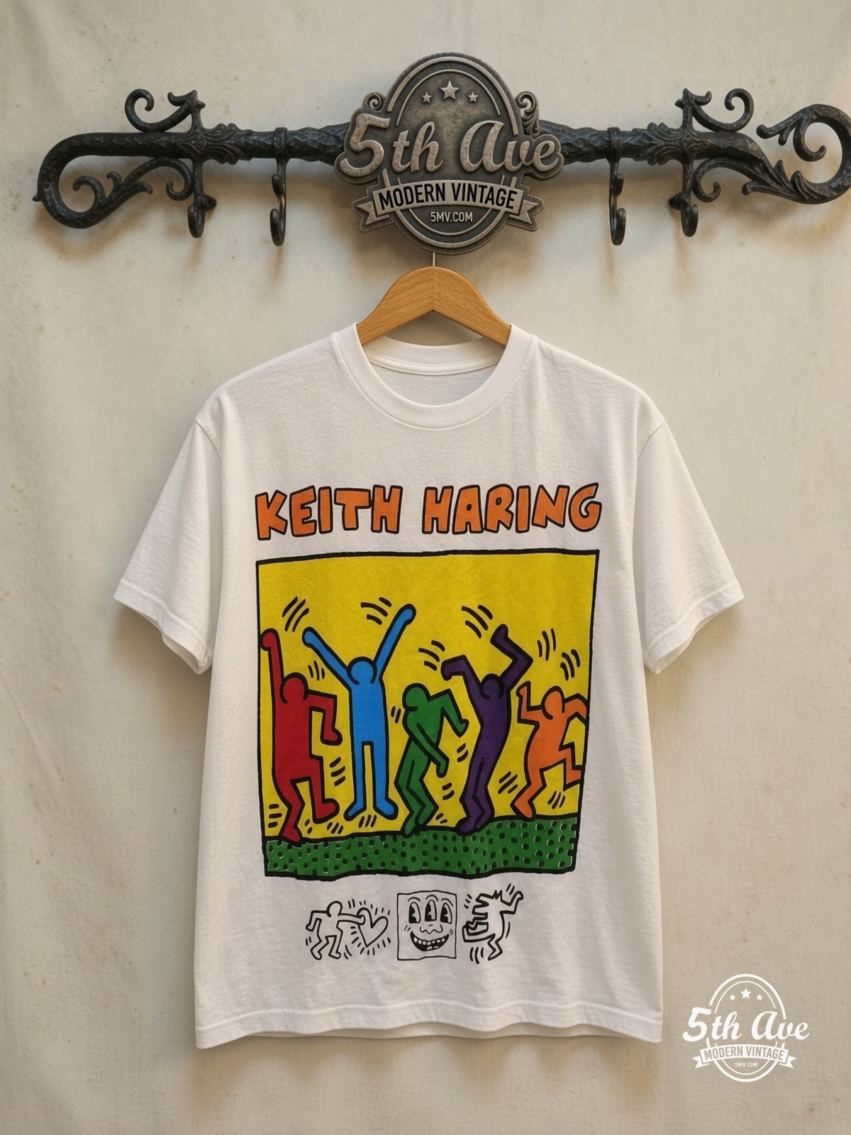 Keith Haring t shirt — front on locked cream ornate 5th Ave rack