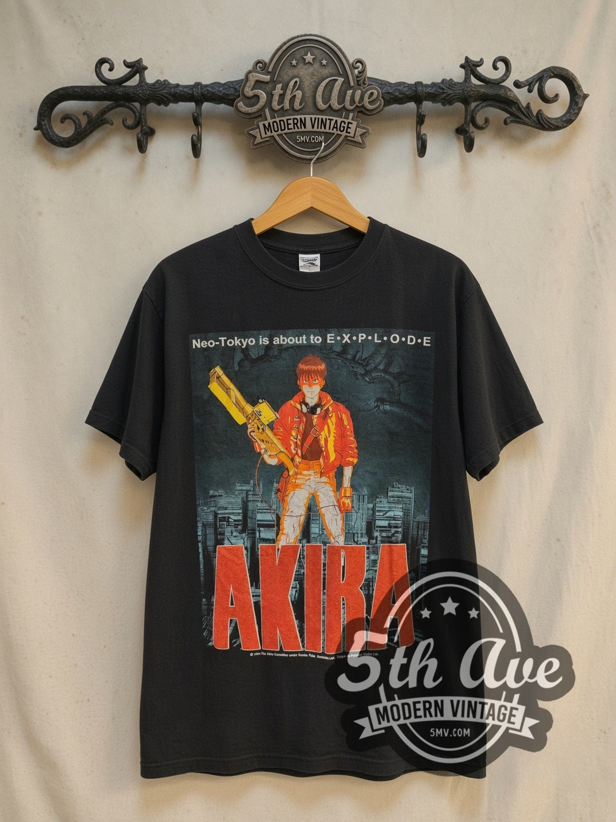 Akira Neo-Tokyo Is About to Explode vintage graphic t-shirt, front view on a display rack