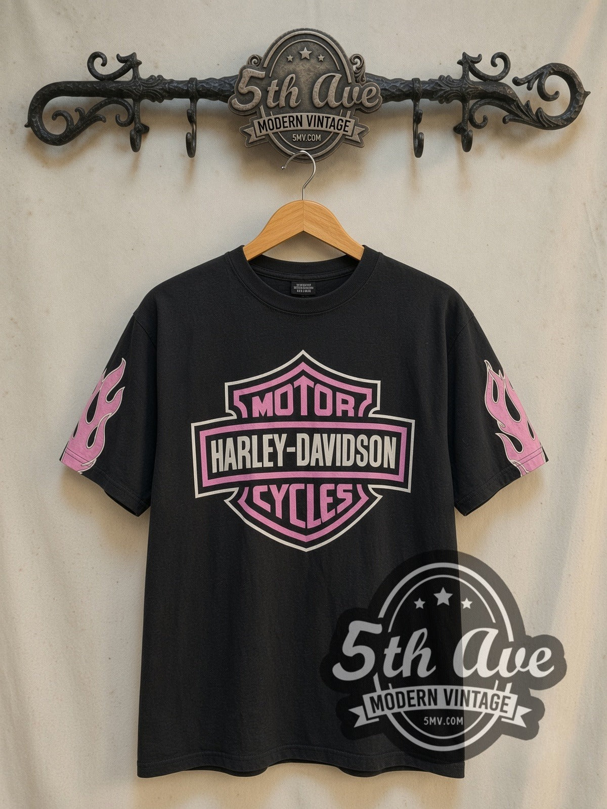 Harley-Davidson Wisconsin Oconomowoc Pink Shield vintage graphic long sleeve t-shirt, front view on a display rack