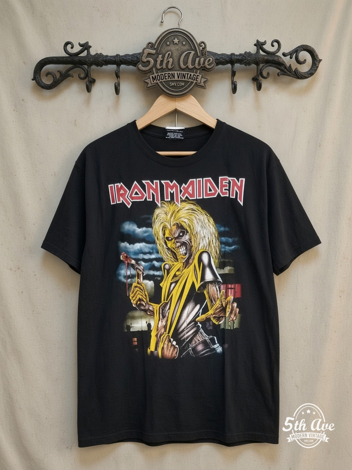 Iron Maiden Killers vintage band t-shirt, front view on a display rack