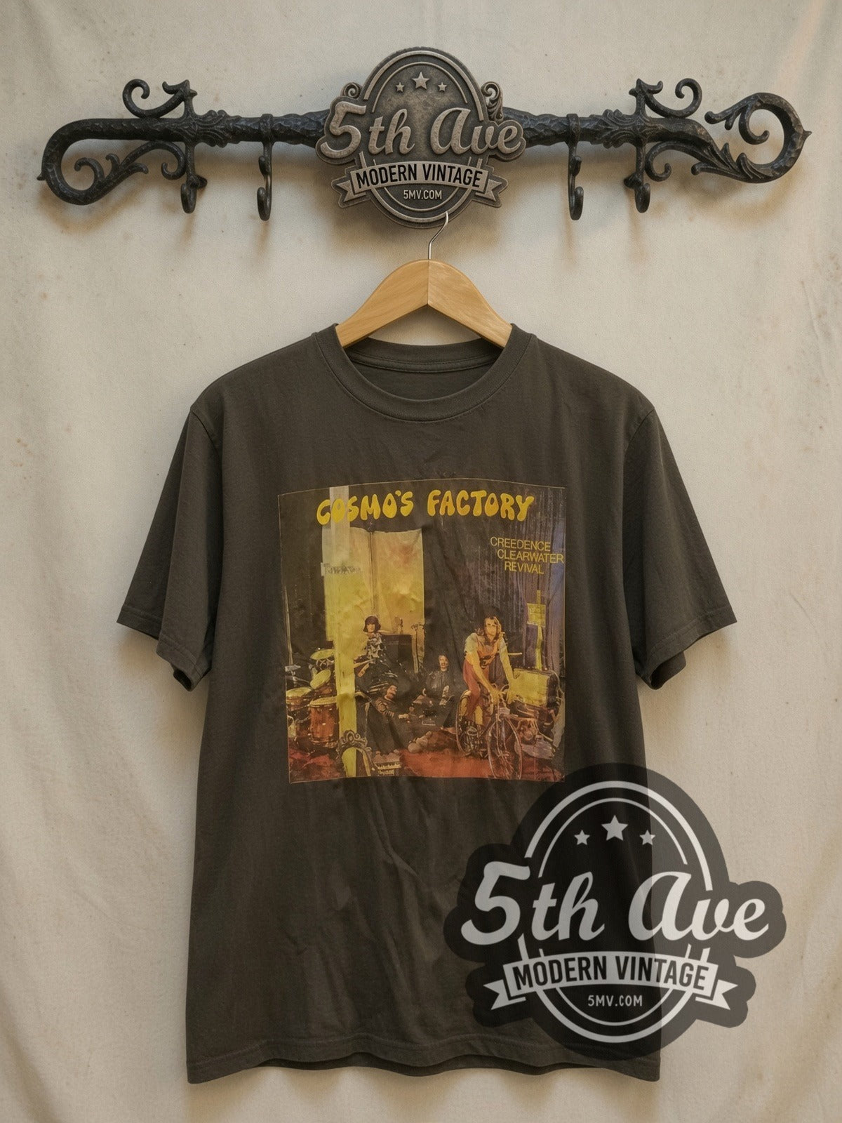 Creedence Clearwater Revival Cosmo's Factory vintage band t-shirt, front view on a display rack