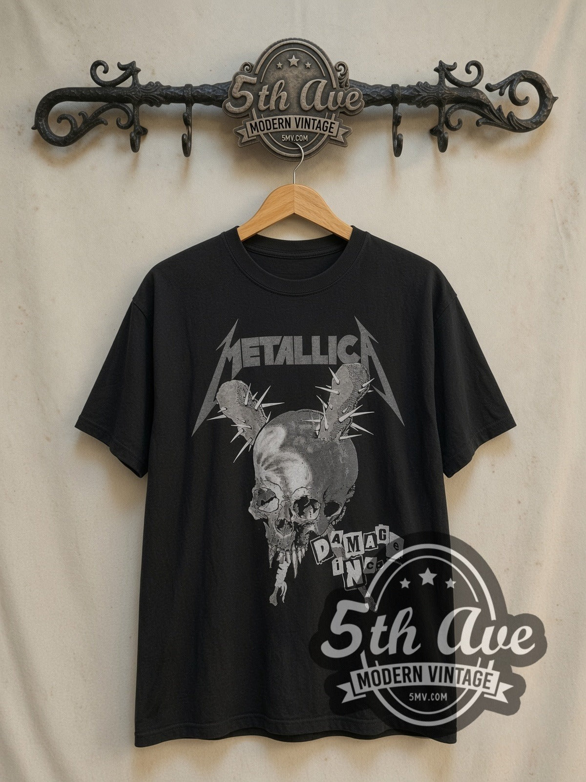 Metallica Damage Inc. Red Crown Pushead Skull vintage band t-shirt, front view on a display rack