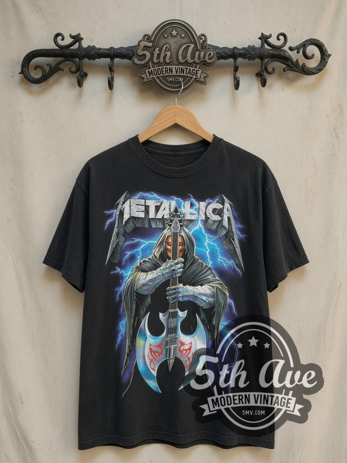 Metallica Hooded Axe Guitar Blue Lightning vintage band t-shirt, front view on a display rack