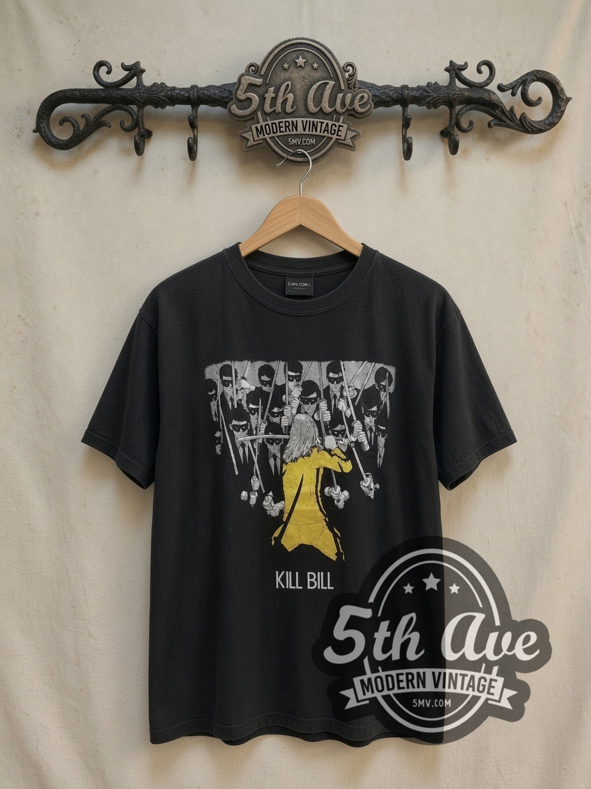 Kill Bill Movie Poster vintage graphic t-shirt, front view on a display rack