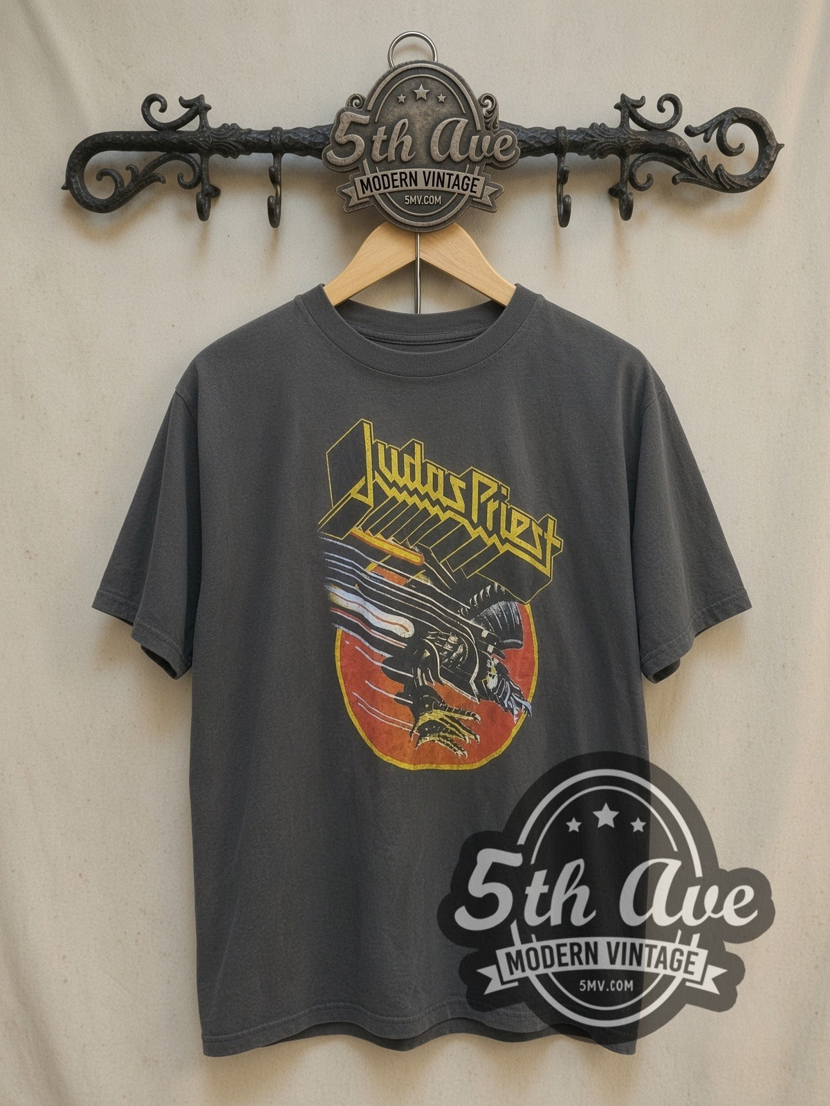Judas Priest Robotic Eagle vintage band t-shirt, front view on a display rack