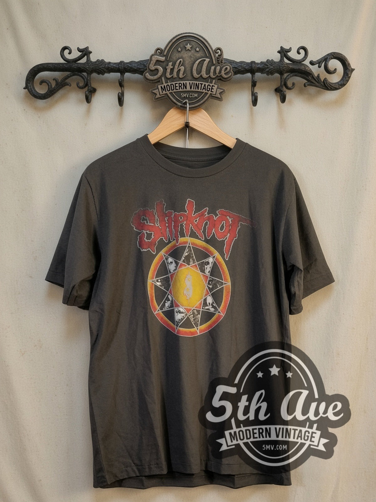 Slipknot Nonagram Tribal S Member Portraits vintage band t-shirt, front view on a display rack