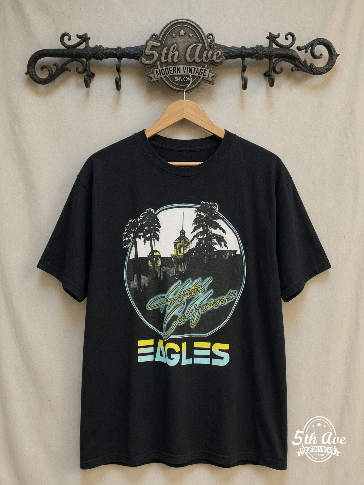 Eagles – Hotel California – Vintage Band T-Shirt — front on locked cream ornate 5th Ave rack